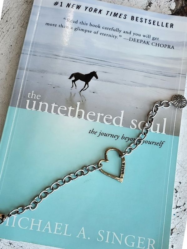 word bracelet on book